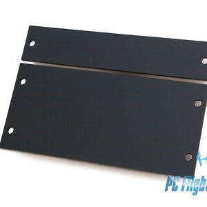 May include: Two black metal plates with holes for mounting. The plates are designed to be used in a server rack.