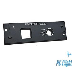 May include: Black metal panel with the text "PROCESSOR SELECT" and a small round button with the text "SP 1 AUTO SP 2".