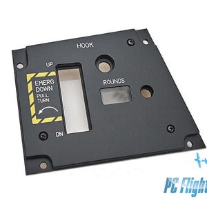 May include: A black control panel with the text "HOOK" and "ROUNDS". It features an "EMERG DOWN PULL TURN" label with an arrow, and the words "UP" and "DN". The panel has several screw holes and a rectangular opening.