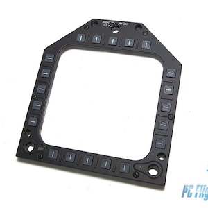 Puede incluir: Panel de metal negro con un recorte cuadrado y varios botones. Los botones están etiquetados como "BRT", "DÍA", "NOCHE" y tienen varias otras marcas.