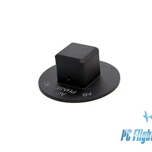 May include: Black plastic switch with a square button and a round base. The base has the text "PHASE AC AB BC" printed on it.