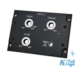 May include: Black panel with multiple round knobs and switches labeled "Signal", "Intr Lt", "Primary", "Dim", "Brt", "Rst", "Flood", "Off", "Press to Test", and "PC Flights".