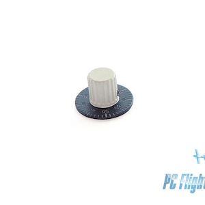 May include: A black knob with a white plastic cap and a numbered dial. The dial has numbers from 0 to 60.