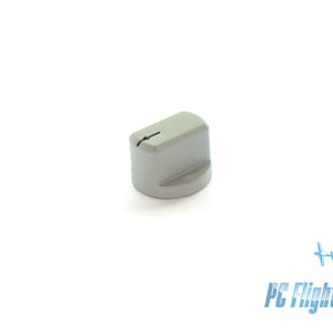 May include: A gray plastic knob with a small arrow pointing to the right.