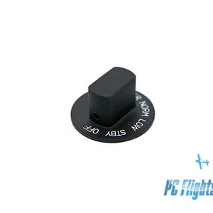 May include: A black control knob with white text reading "OFF", "STBY", "LOW", and "NORM". The knob has a rectangular top and a circular base. The image is on a white background.