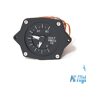 May include: A black round gauge with a white face and a needle pointing to 40. The gauge reads "DUCT PRESS PSI" and has markings from 0 to 80.