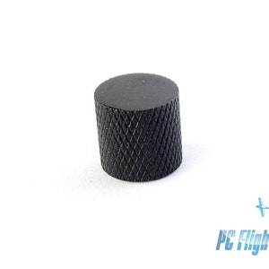 May include: Black knob with a diamond pattern on the surface.