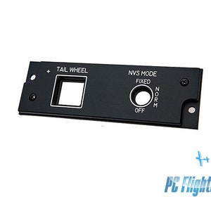 May include: Black metal panel with a square cutout labeled "Tail Wheel" and a round toggle switch labeled "NVS Mode" with the options "Fixed", "Norm", and "Off".