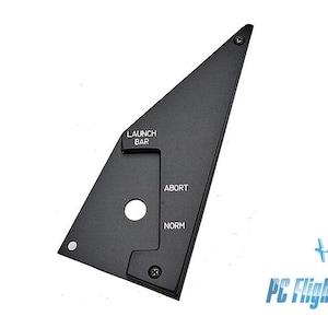 May include: Black triangular control panel with the text "LAUNCH BAR", "ABORT", and "NORM". The panel has a circular hole and is secured with screws. The logo "PC Flights" is in the bottom right corner.
