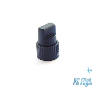 May include: A black plastic knob with a ribbed base and a flat top. The knob is designed for use with a control panel or other electronic device.