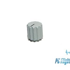 May include: A gray plastic knob with a single slot on the top. The knob has a textured, ribbed design.