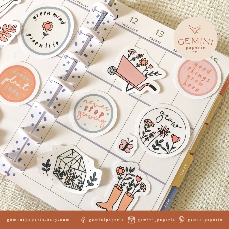 May include: A set of colorful stickers with a gardening theme. The stickers feature illustrations of plants, flowers, a wheelbarrow, a greenhouse, and a butterfly. The stickers also include text such as "green mind", "green life", "crazy plant lady", "never stop growing", "grow", and "good things grow here".
