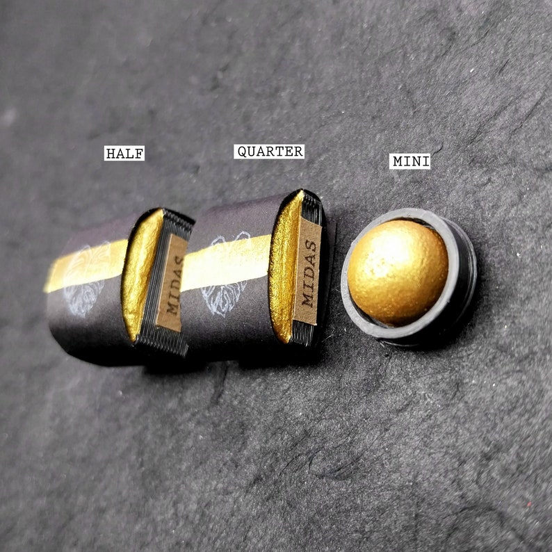 May include: Three different sizes of gold pigment in black containers labelled "Half", "Quarter", and "Mini" with the word "MIDAS" printed on the containers.