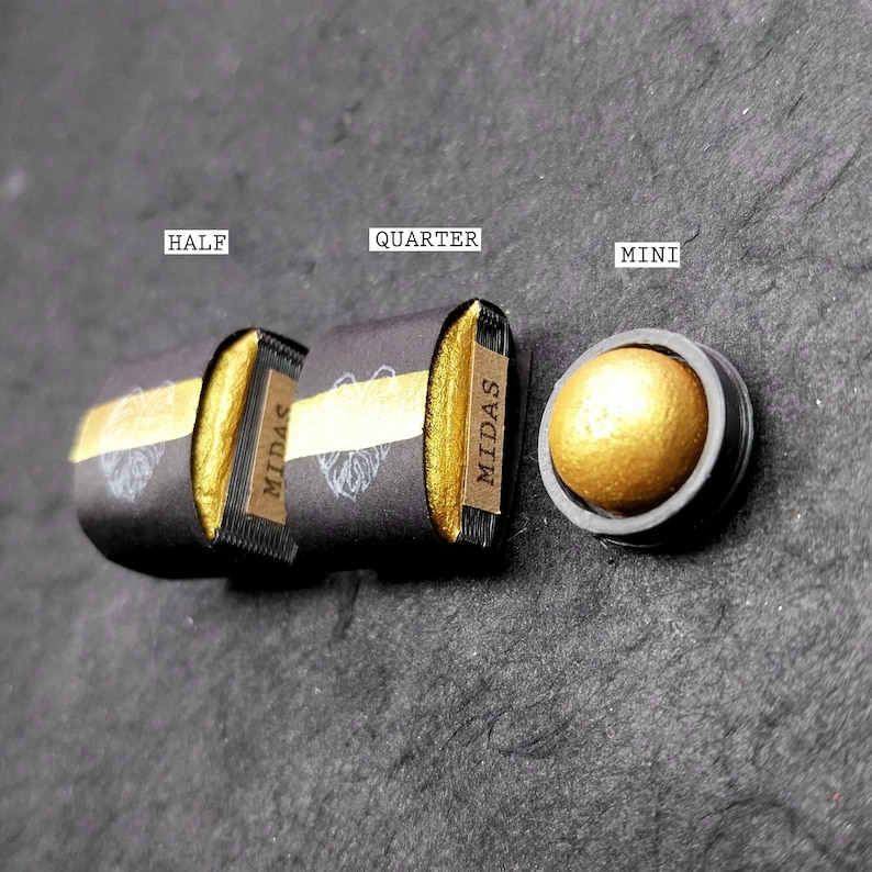 May include: Three different sizes of gold pigment in black containers labeled "Half", "Quarter", and "Mini". The containers are labeled "MIDAS" and have a gold stripe.