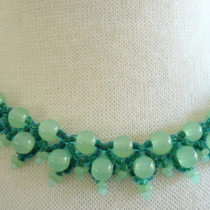 unusual necklace with rare jade pearls from Myanmar. Dark green and light green in a delicate lace look
