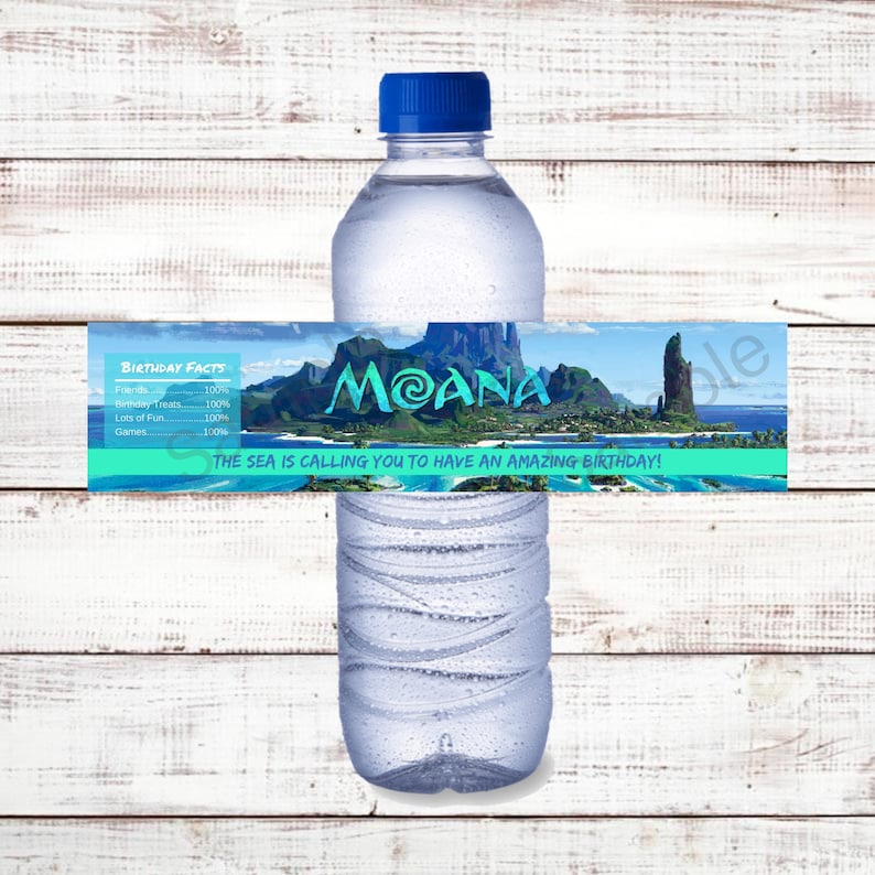 May include: Water bottle label with a blue background and a picture of a tropical island with the text "MOANA" in a green circle. The text "THE SEA IS CALLING YOU TO HAVE AN AMAZING BIRTHDAY!" is below the picture. The label also includes a list of birthday facts with the text "BIRTHDAY FACTS" at the top.