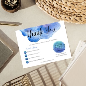 May include: Thank You card with a watercolor background in shades of blue. The card includes a 10% off discount code, THANKYOU10, and encourages customers to connect with the business on social media. The card also expresses appreciation for supporting small businesses and encourages customers to tag the business in their photos.