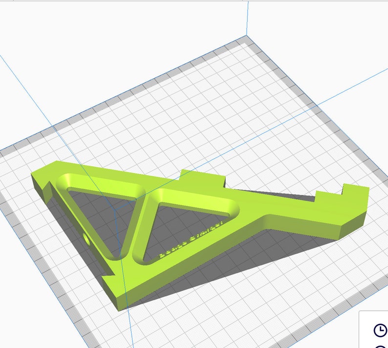 K&ouml;nnte beinhalten: Ein dreieckiges Objekt aus limegr&uuml;nem, 3D-gedrucktem Kunststoff mit einem Loch in der Mitte und dem Text "3D-Printed STL File" auf der Oberfl&auml;che.