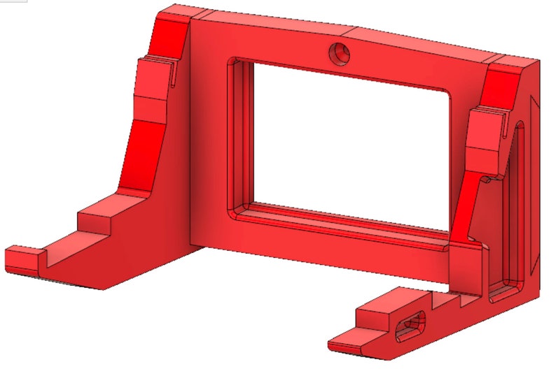 May include: A red plastic wall mount with a rectangular opening in the center. The mount has a small hole at the top for hanging.