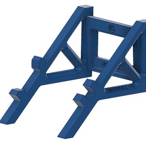 May include: A blue plastic wall mount stand for a Red Bull Formula 1 car model. The stand has a triangular shape with a rectangular opening in the back for mounting.