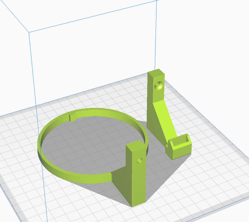 May include: A 3D printed green plastic holder for a circular object, such as a fan or a speaker. The holder has a base and a ring that can be adjusted to fit different sizes.