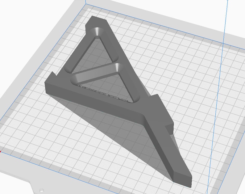 May include: A gray 3D printed model of a triangular support structure with a series of internal supports. The model is designed to provide stability and strength.