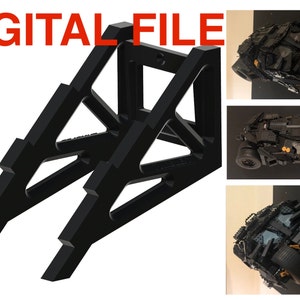 May include: A black 3D printed stand designed to display a Lego model of the Batmobile. The stand is made of two triangular supports that connect at the top. The stand is shown with a Lego Batmobile model in the background.