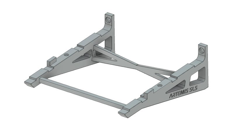May include: A gray metal stand with a triangular design and the text "ARTEMIS SLS" printed on the side. The stand is designed to hold a laptop or other device.
