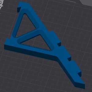 May include: A blue plastic 3D printed object with a triangular shape and a long, thin base. The object has a series of small holes along the base.