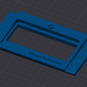 May include: A blue plastic mold for making a classic automobile model. The mold has a rectangular opening with the words "Classic Automobile" inscribed on the bottom.