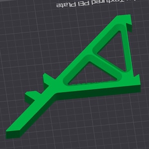 May include: A bright green, 3D-printed object with a unique geometric design. The object has a triangular shape with a central cutout and extended arms. The design is modern and appears to be a functional tool or component.