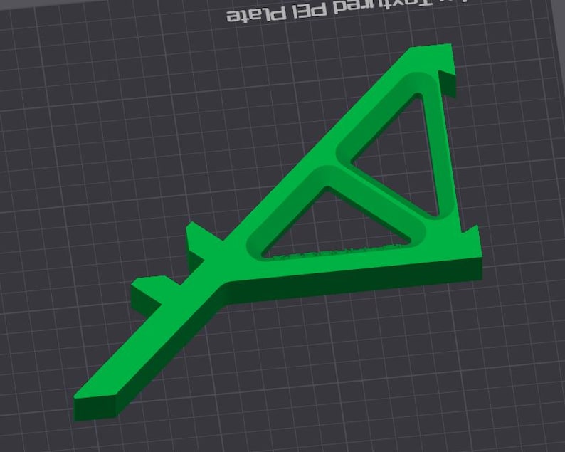 May include: A bright green, 3D-printed object with a unique geometric design. The object has a triangular shape with a central cutout and extended arms. The design is modern and appears to be a functional tool or component.