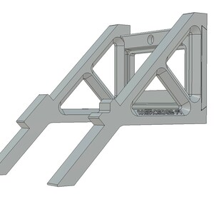 May include: A gray metal corner brace with a triangular shape and a small hole in the center. The brace has a decorative design with a repeating pattern of lines and angles. The brace is labeled "WERCEDES 97".