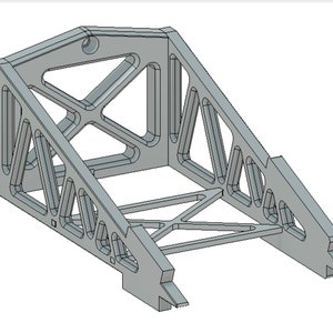 May include: A gray metal stand with a triangular shape and a lattice design. The stand has a flat top and a base with two angled legs.