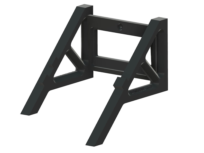 May include: Black plastic wall mount with a triangular design. The mount has a rectangular opening in the centre.