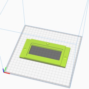 May include: A lime green plastic rectangular box with a rectangular opening in the center. The box has four small holes on the sides.