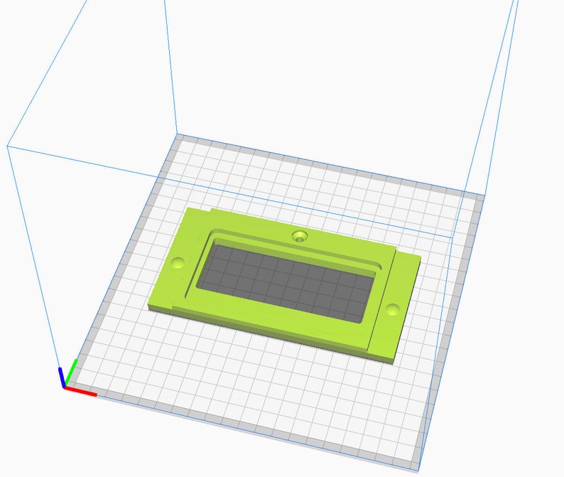 May include: A lime green plastic rectangular box with a rectangular opening in the center. The box has four small holes on the sides.