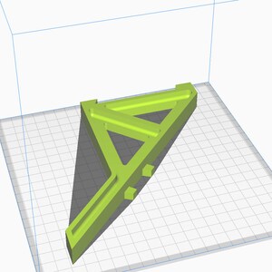 May include: A 3D printed model of a green triangular structure with a long, thin arm extending from the base. The model is designed with multiple internal supports and appears to be a prototype or design concept.