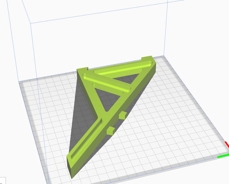 May include: A 3D printed model of a green triangular structure with a long, thin arm extending from the base. The model is designed with multiple internal supports and appears to be a prototype or design concept.