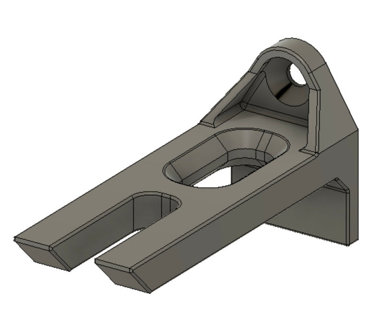 May include: A gray metal bracket with two slots and a round hole. The bracket is designed to be mounted to a wall or other surface.