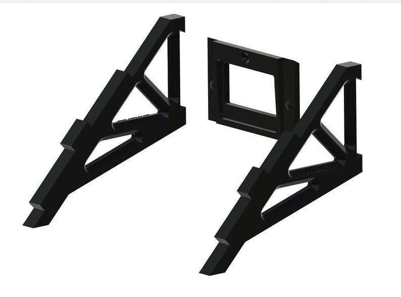 May include: Two black plastic triangular stands with a rectangular opening in the middle. The stands are designed to hold a phone or other device.