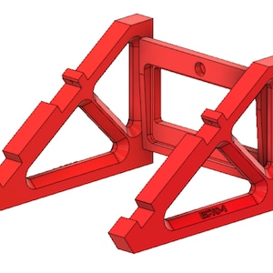 May include: A red, geometric bracket with an open rectangular center. The bracket has angled supports and a series of cutouts. The design includes a small hole and the text "EC704A".