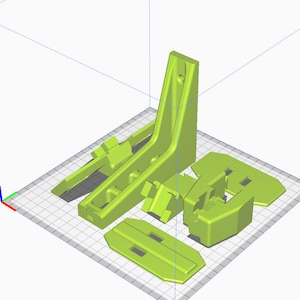 Puede incluir: Un conjunto de cinco piezas de pl&aacute;stico impresas en 3D de color verde lima. Las piezas son de diversas formas y tama&ntilde;os, incluyendo una pieza rectangular alta con un agujero en la parte superior, una pieza rectangular m&aacute;s peque&ntilde;a con un borde curvo y una pieza curva con un agujero en el centro.