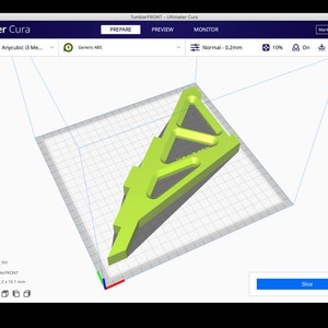 May include: A 3D model of a green object with a complex design is shown on a computer screen. The object is 195.2 x 177.2 x 16.1 mm. The screen shows the Ultimaker Cura software, which is used for 3D printing.