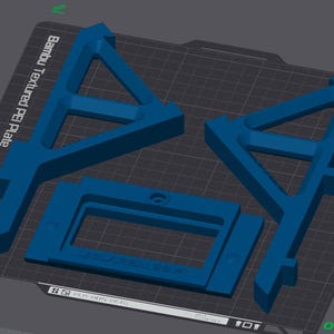 May include: A 3D-rendered image of blue plastic components, including two triangular supports and a rectangular frame. The components are arranged on a dark gray surface with a grid pattern. Text on the surface reads "Bambu Textured PEI Plate".