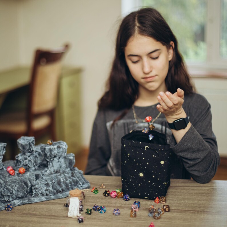 Dice bag standing upright with square bottom
