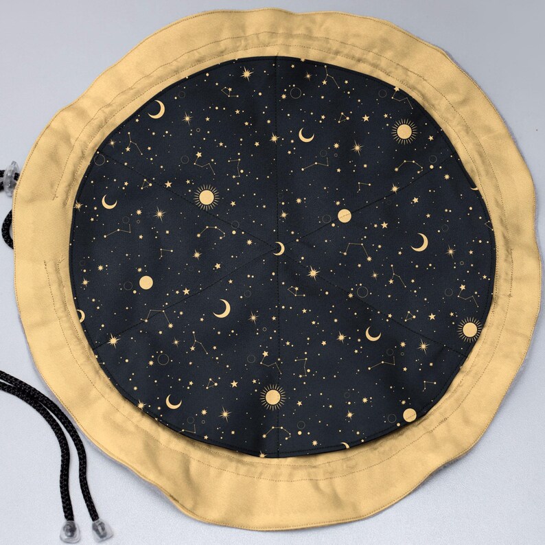 Round bottom galaxy dice pouch standing upright on table
