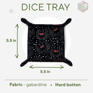 May include: Black dice tray with a bat and star pattern. The tray is 5.5 inches wide and 5.5 inches long. It is made of gabardine fabric and has a hard bottom.