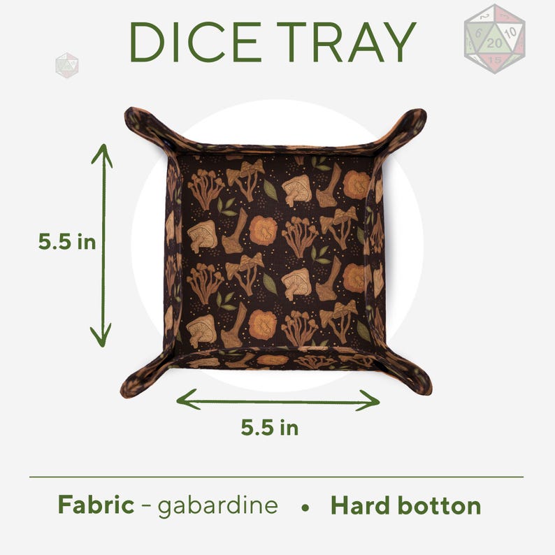 May include: A square dice tray with a dark brown background featuring a repeating pattern of tan and orange mushrooms and green leaves. The tray measures 5.5 inches by 5.5 inches. It is constructed with a gabardine fabric surface and a hard bottom.