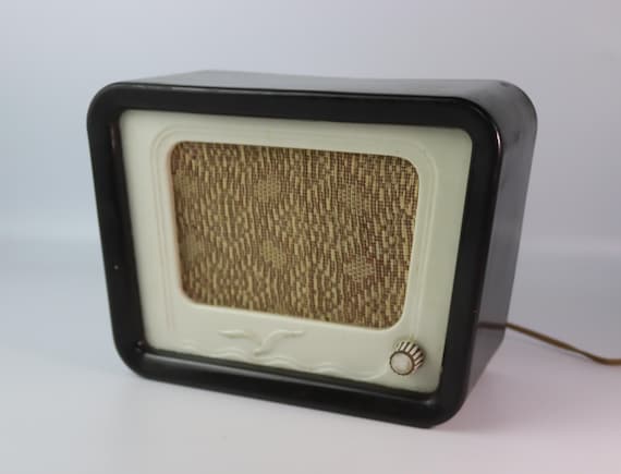 An original 1950s USSR Bakelite radio shell — not a reproduction, an actual Cold War artifact you can put on a shelf and explain to every visitor.
